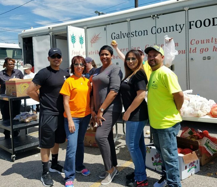 nicole center volunteering at galveston food bank with safety team partners texas regional safety services